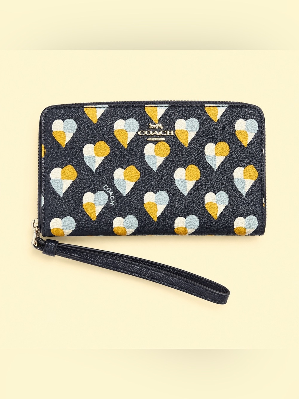 Coach Wristlet with Yellow, light blue, and White Hearts print.